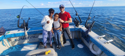Family fishing, calm waters, good times.